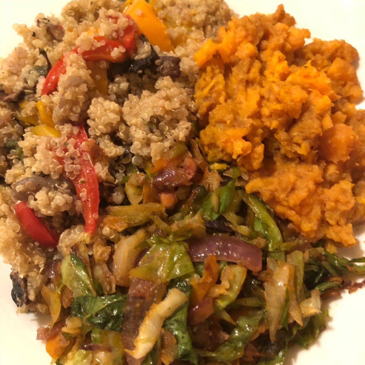 Spicy stir fried cabbage, quinoa with stir fried veggies, and softened sweet&nbsp;potatoes